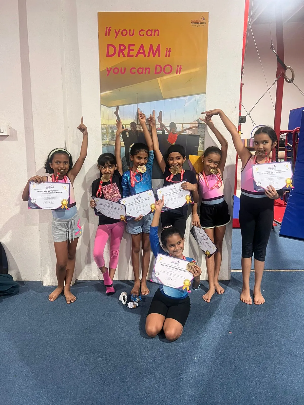 EGA gymnasts holding certificates