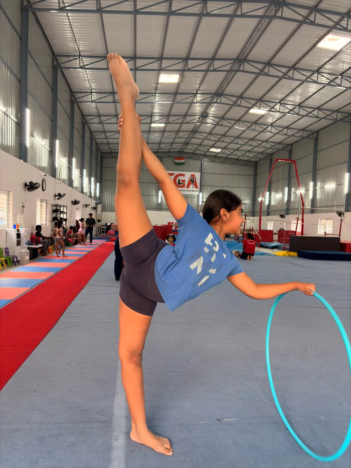 Rhythmic gymnast with a hoop in the EGA training hall